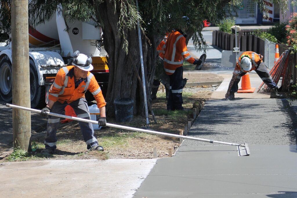 Concrete contractors building a sidewalk in Peoria, IL
